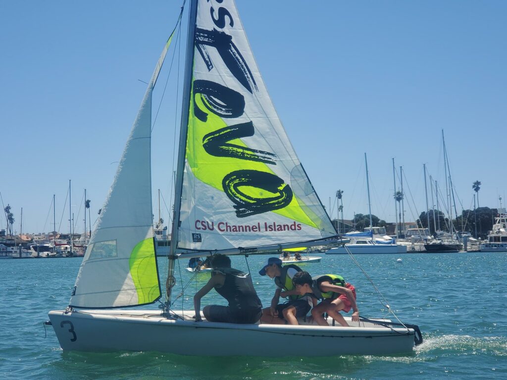 Group sailing RS Feva sailboat